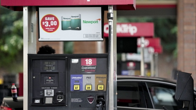 A person pumping gas at a QuikTrip.