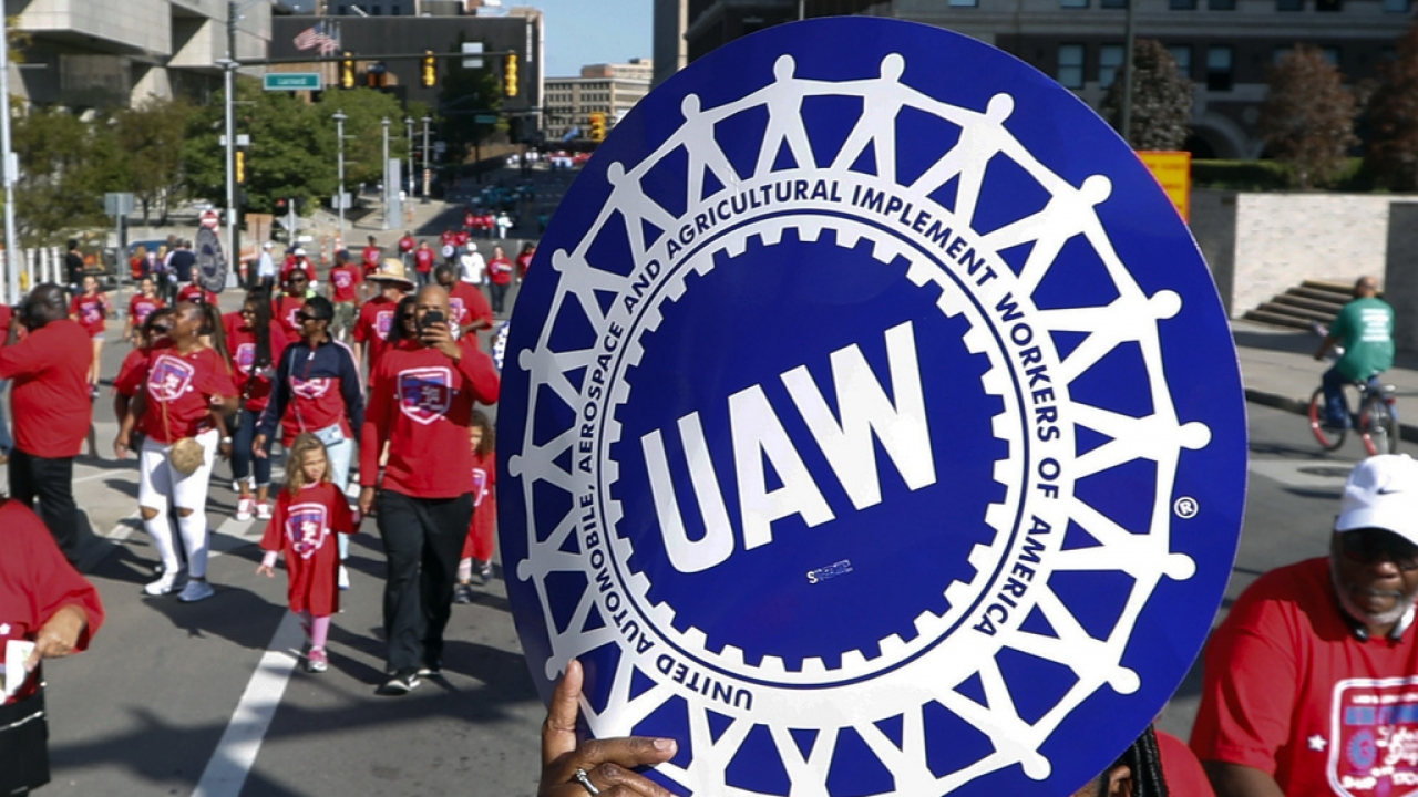United Auto Workers members walk in the Labor Day parade in Detroit, Sept. 2, 2019.