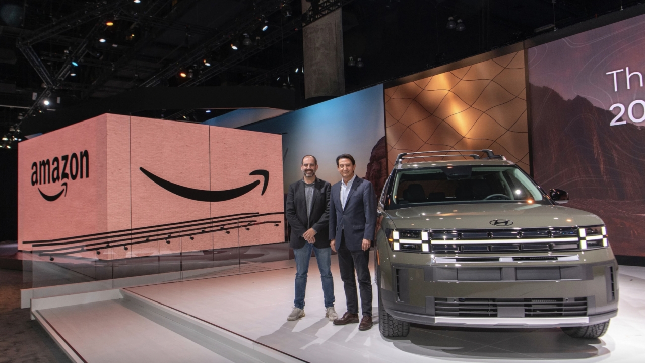 Unveiling of Hyundai car on stage next to an oversized Amazon package