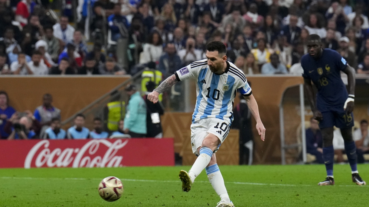 Argentina's Lionel Messi scores a goal from the penalty spot in a World Cup match.