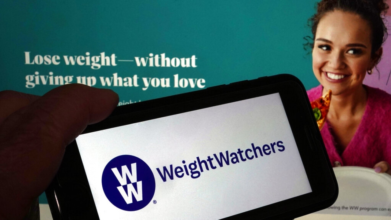 The WeightWatchers logo on a phone.